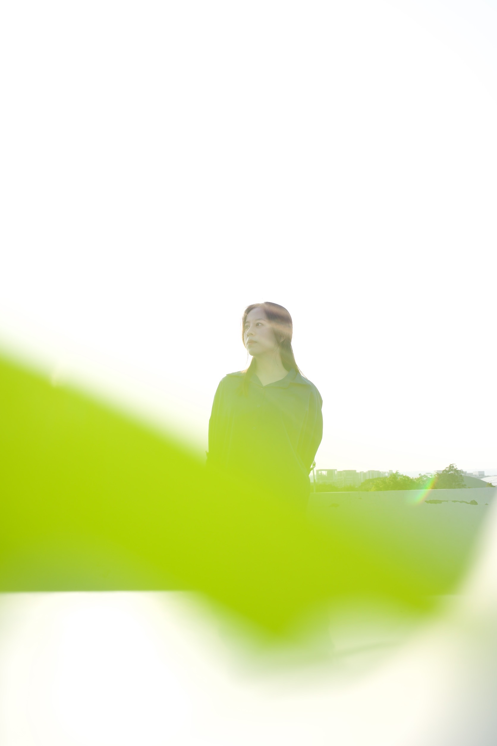 Portrait with green lens flare